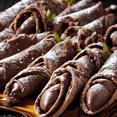 chocolate pastries are arranged on a platter