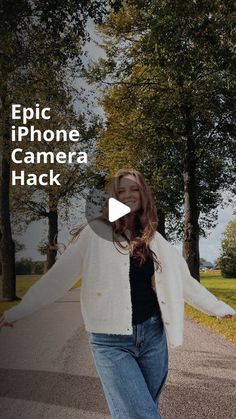 a woman is walking down the street with her arms spread out in front of her