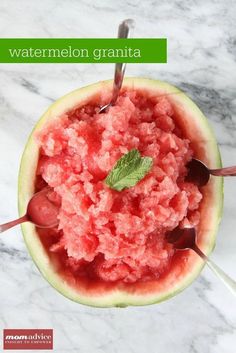 watermelon and mint ice cream in a bowl on a marble table with spoons