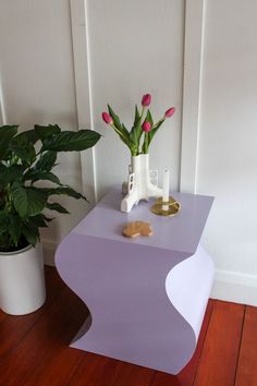 a purple table with some flowers on it