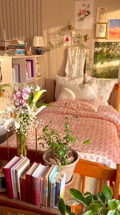 a bed room with a neatly made bed and lots of books