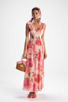 Adorn yourself in floral this season. The Evie Dress is rich, layered, and gorgeous from head to toe. The long skirt adds length and the square neck adds grace to your feminine figure. Pair it with the head scarf for a main character moment. Maxi length Square neckline Rose pattern Dry clean only Long Summer Dresses Floral, Dresses With Scarf, Floral Maxi Dress Outfit, Soft Boho Aesthetic, Floral Pink Dress, Dress With Scarf, Vacation Maxi Dress, Feminine Summer, The Nanny