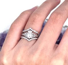 "These are three separate rings. You can wear them in a combination of ways. Wear the V-ring by itself, or double it up and wear the two V-rings stacked together. You can add it to your favorite ring for a whole new look. And then, you can wear just the Dainty Claddagh solitary. So many ways to enjoy these great sterling silver rings. The V-ring: Our dainty Sterling Silver V-band pairs so beautifully with Our Sterling Silver Claddagh Ring. This certainly makes a stunning set.   The Claddagh ring Claddagh Ring Wedding Band, Engagement Rings Claddagh, Claddagh Wedding Ring Set, Claddagh Engagement Ring Set, Claddagh Engagement Ring Wedding Bands, Knot Tattoos, Claddagh Wedding Ring, Christian Jewellery, Irish Engagement Rings