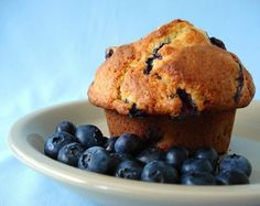 a muffin with blueberries on a plate