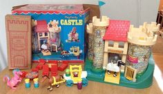 there are many toys on the table and in front of it is a toy castle