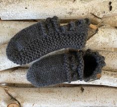 Cozy hand knit women's slippers.  50% wool  -- 50% acrylic.  Hand wash cold  --  dry flat.  Crafted in a smoke free home.   S/M fits APPROXIMATELY sizes 6.5-8 and M/L fits APPROXIMATELY sizes 8.5-10.  However, these slippers will stretch to fit many sizes. Casual Winter Yarn Slippers, Cozy Wool Slippers For Winter, Hand Knitted Yarn Slippers For Winter, Cozy Knitted Yarn Slippers, Gray Textured Winter Slippers, Gray Slip-on Slippers For Indoor Use, Cozy Hand-knitted Slippers With Round Toe, Gray Slip-on Indoor Slippers, Comfortable Wool Slip-on Slippers