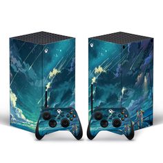 two video game controllers sitting side by side in front of a blue sky with stars