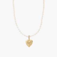 You know you have a heart of gold and now everyone else will know too! This shiny gold heart charm features small crystal stones strategically placed on the surface of the heart for maximum sparkle. The light reflects off the stones and the gold at every moment. The connector piece also features crystal stones that create the ultimate sparkle, shine, and love trio. This charm is ideal for use on the Memories Base Pearl Necklace.- Gold plating over brass- Cubic zirconia- Available in Yellow Gold Pearl Necklace With Heart, Necklace With Heart, Cultured Pearl Necklace, Gold Pearl Necklace, Crystal Stones, Gold Heart, Heart Of Gold, Cultured Pearls, Necklace Gold