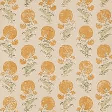 an orange and white wallpaper with flowers on it