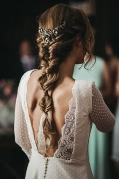 the back of a woman's head wearing a wedding hair piece