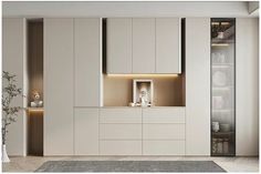 a kitchen with white cupboards and lights on the wall, along with an area rug