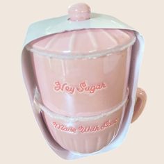 a pink plastic cup with a lid on it's side and the words, my sugar made with love