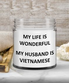 a glass jar that says, my life is wonderful my husband is tanzann