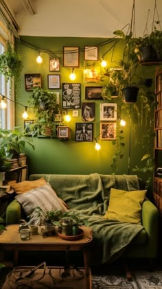 a living room filled with lots of plants and pictures on the wall