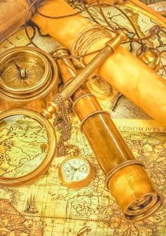 an old world map with compass, magnifying glass and other items on it