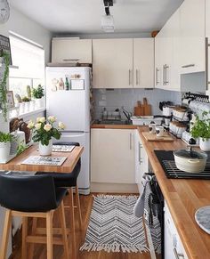 the kitchen is clean and ready to be used for cooking or eating, while also being used as a dining area