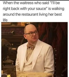 a man sitting at a table in front of a laptop computer with the caption when the waitress who said i'll be right back with your sauce is walking around the restaurant living her best life