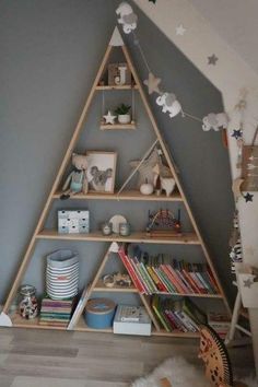 a triangle shaped shelf in the corner of a room