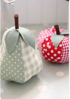 two fabric pumpkins sitting next to each other