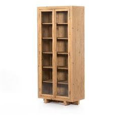 a tall wooden bookcase with glass doors on the front and bottom shelves, against a white background