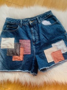 Get your hands on these ONE OF A KIND handmade reworked and upcycled patchwork denim shorts with patched legs and a gorgeous pink patchwork.  This piece is made from a size uk 12 pair of blue jeans  shorts, made with recycled materials and lots of love We do accept returns and exchanges at the buyer's expense if the sizing or fit doesn't work for you when the item arrives Denim Blue Jean Shorts With Patch Pockets, Patchwork Jean Shorts, Cotton Patchwork Cutoff Jeans, Summer Patchwork Recycled Denim Bottoms, Summer Recycled Denim Patchwork Bottoms, Medium Wash Cotton Jean Shorts With Patch Pockets, Trendy Cotton Bottoms With Patches, Diy Jean Ideas, Patchwork Medium Wash Denim Jean Shorts