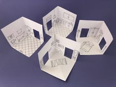 four pieces of paper cut out to look like houses with rooms in the middle and furniture on each side