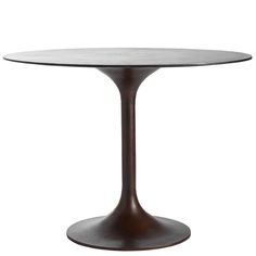 an oval dining table with a wooden base