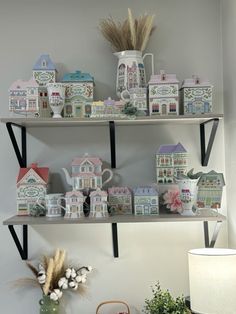 two shelves filled with different types of house figurines