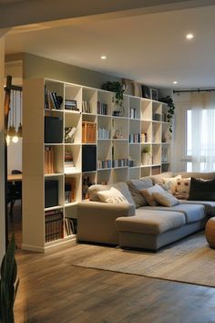 a living room filled with furniture and bookshelves