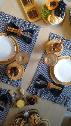 a table topped with plates and bowls filled with food