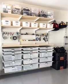 an organized garage with lots of storage bins