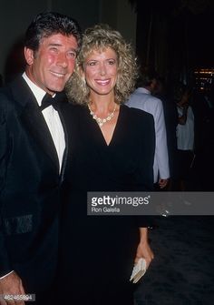 a man and woman standing next to each other in formal wear at an event stock photo