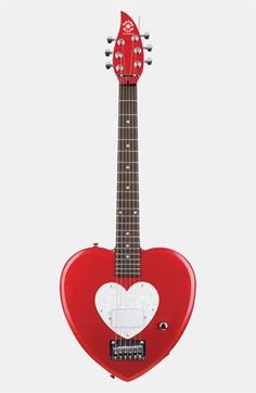 a red and white heart shaped electric guitar