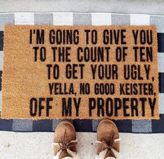 someone standing in front of a door mat that says i'm going to give you to the court of ten to get your ugly vella no good kester off my property