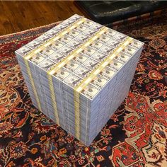 stacks of money sitting on top of a rug