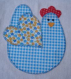 a close up of a bird on a blue and white checkered cloth