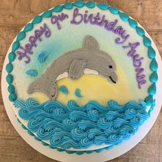 a birthday cake with a dolphin on it