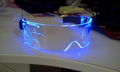 a pair of glowing glasses sitting on top of a table