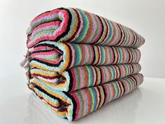 stack of multicolored towels folded on top of each other