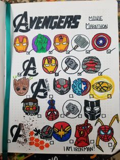 an open notebook with avengers stickers on it