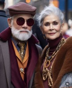 an older man and woman standing next to each other