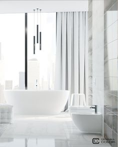 a white bathtub sitting next to a window in a bathroom with tall buildings behind it