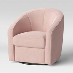 a pink swivel chair sitting on top of a white floor next to a wall