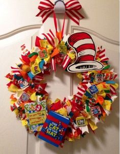 a cat in the hat wreath hanging on a door