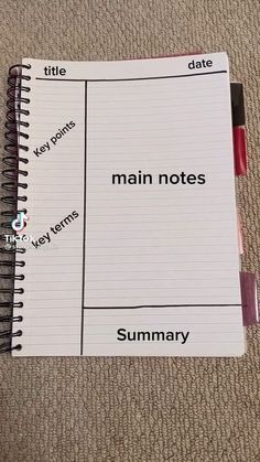 a notebook with the words main notes written in red and black on top of it