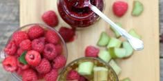 raspberry rhubar jam in small glasses with fresh raspberries