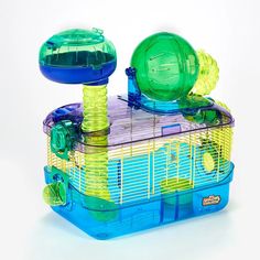 a hamster cage with two large green and one small blue ball in the top