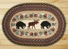 a rug with two bears and moose silhouettes in the center on a white background