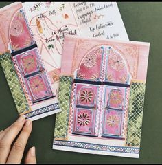 two handmade greeting cards with pink and green doors