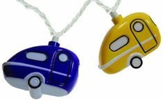 two toy cars are hanging from strings on a white background, one is blue and the other is yellow